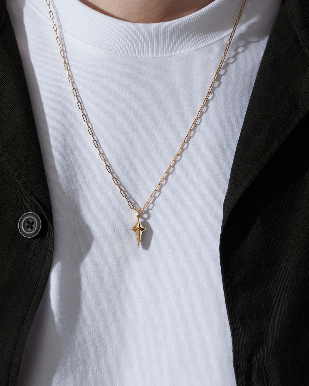 Stephen Webster New Cross pendant in 18 ct yellow gold on 24-inch chain — front view showing cross design and gold finish