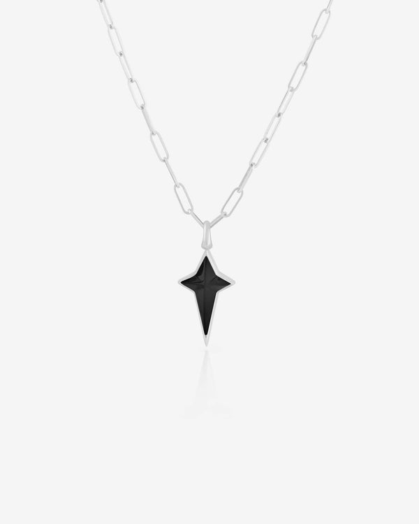 Stephen Webster New Cross pendant in silver with black onyx inlay, hanging on chain — full cross silhouette visible