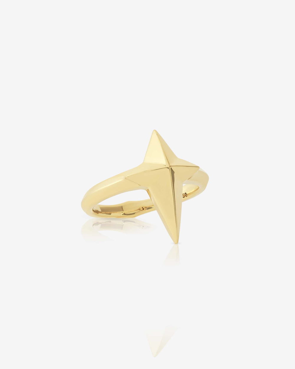 Angled close-up of New Cross ring in 18 ct gold — highlighting three-dimensional cross motif and smooth polished surface