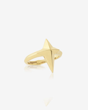 Angled close-up of New Cross ring in 18 ct gold — highlighting three-dimensional cross motif and smooth polished surface