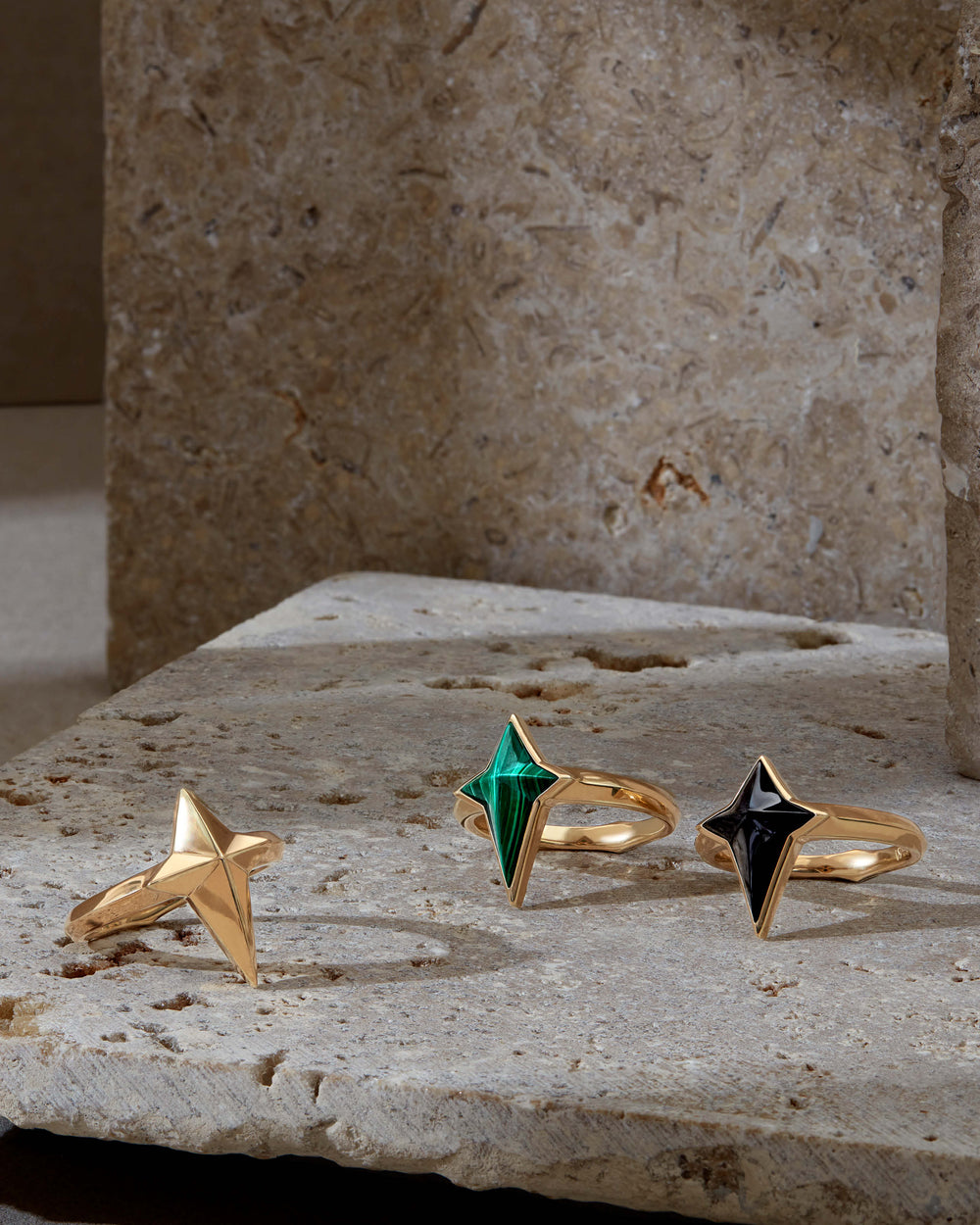 Angled close-up of New Cross ring in 18 ct gold — highlighting three-dimensional cross motif and smooth polished surface