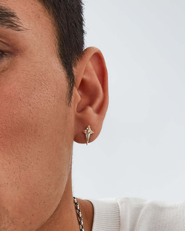 Model wearing Stephen Webster New Cross diamond stud earring — visible on ear, showing size, sparkle and gold finish