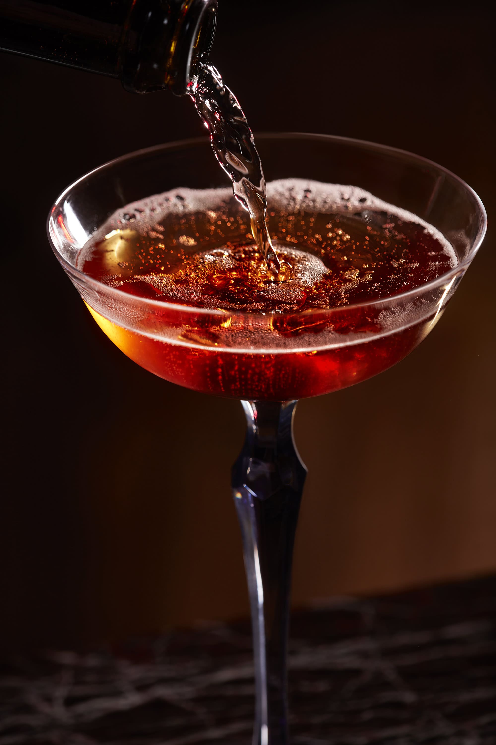 Close-up of artisan cocktails served at No Regrets Lounge cocktail bar