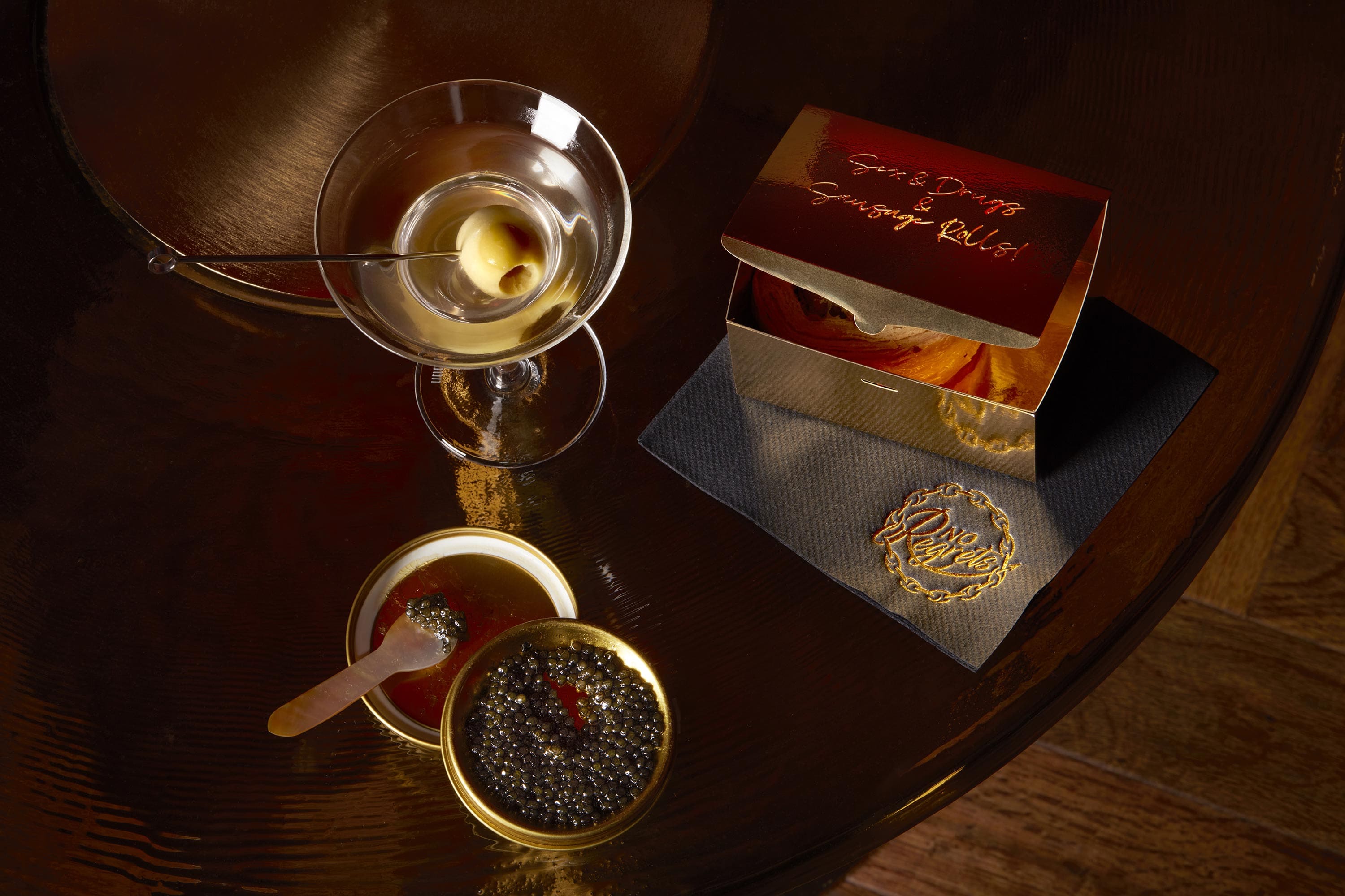 Gourmet snacks such as Sex & Drugs & Sausage Roll served at No Regrets Lounge