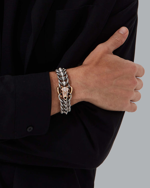 Model wearing Stephen Webster Rams Head bracelet in sterling silver and 18 k yellow gold