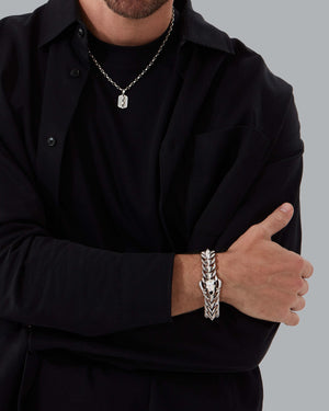 Model wearing Stephen Webster Rams Head Bracelet in polished sterling silver on wrist