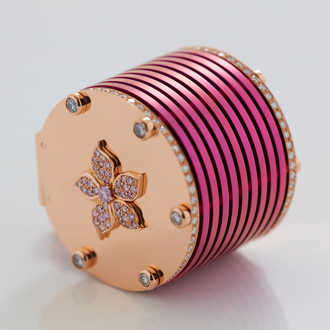 Close-up of RESET clicker design showing diamond and ruby detailing