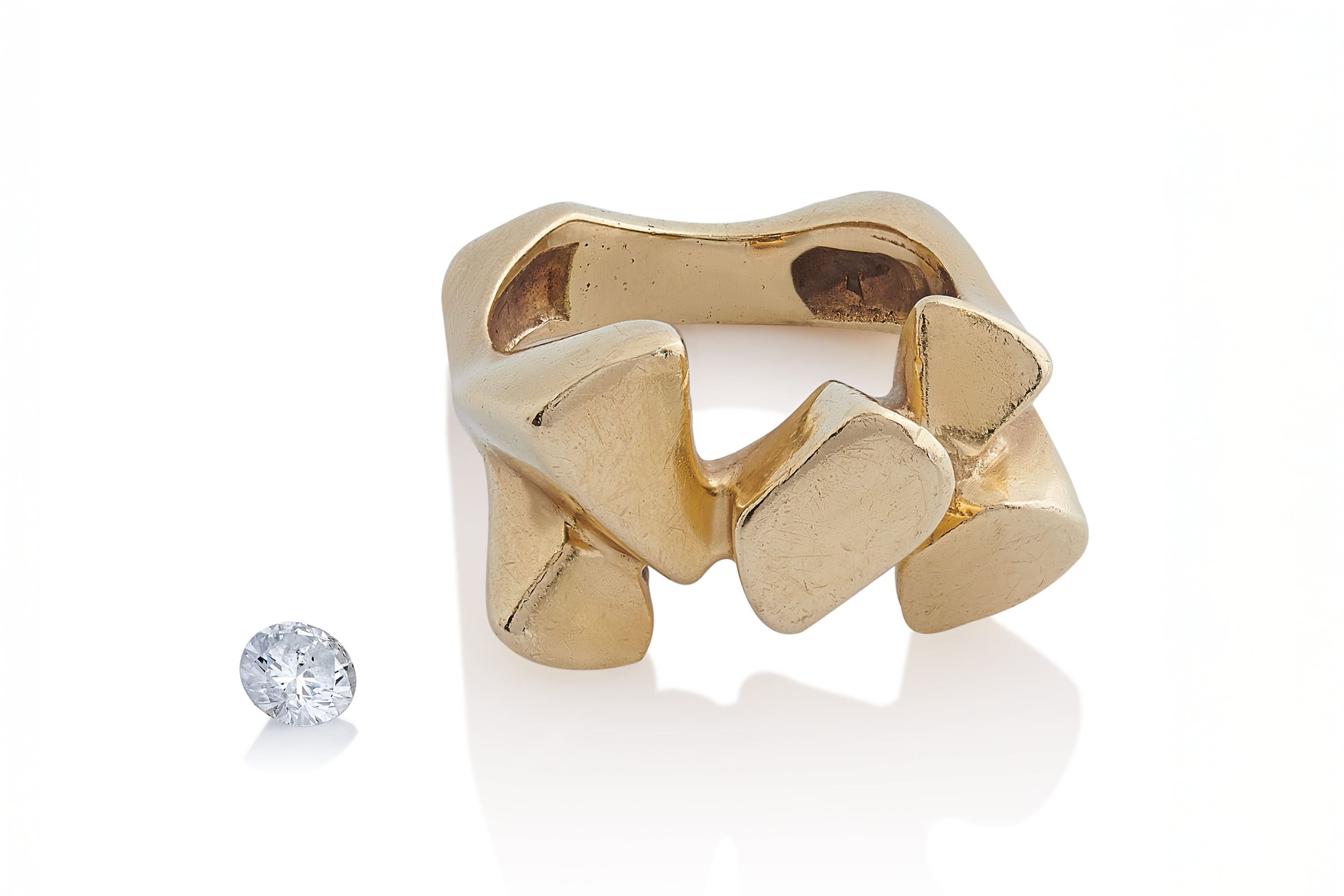 Vintage engagement ring from 1975 used as reset material in bespoke redesign