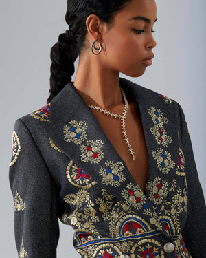 Stephen Webster Russian Roulette Magazine necklace worn as part of a styled look, highlighting its rebellious elegance and sculptural gold design