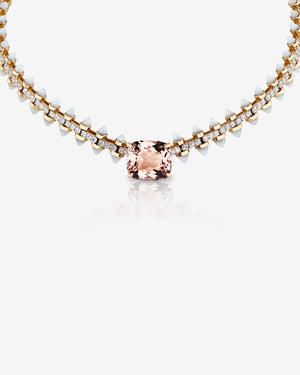 Close-up of the Stephen Webster Russian Roulette Wheel necklace showcasing central cushion-cut morganite, white mother-of-pearl bullet details and pavé white diamonds in polished yellow gold