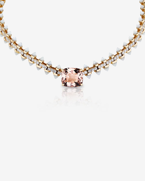 Close-up of the Stephen Webster Russian Roulette Wheel necklace showcasing central cushion-cut morganite, white mother-of-pearl bullet details and pavé white diamonds in polished yellow gold