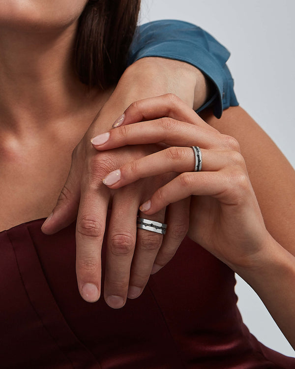 Model wearing Stephen Webster Thorn Fine Inscription Band in 18 k white gold with black diamonds