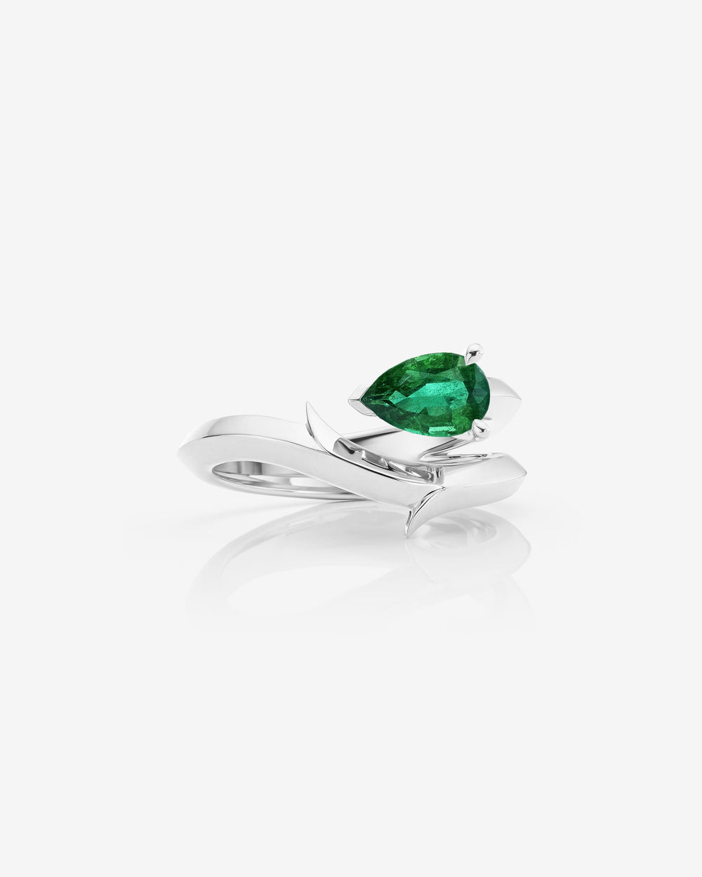 Stephen Webster Thorn Floating Solitaire Slimline Ring in platinum with pear-cut emerald engagement ring