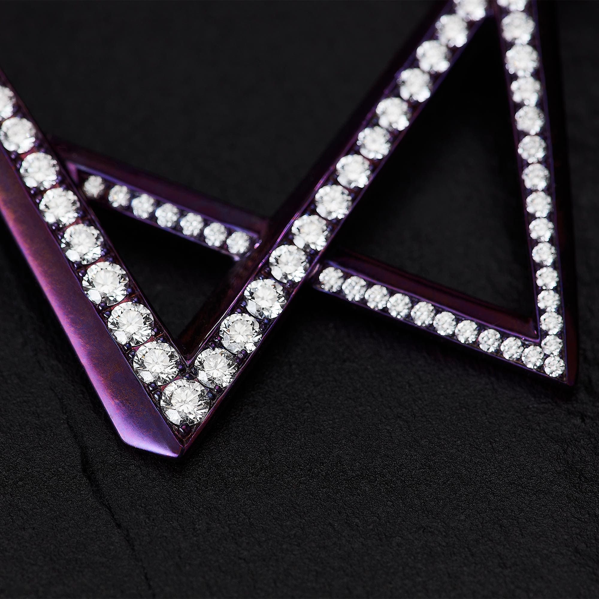Diamond pavé setting close-up showing white and black diamonds in fine jewellery
