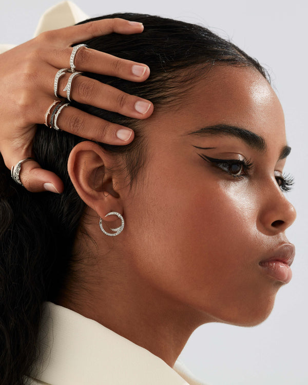 Stephen Webster Stem White Diamond Mini Hoop Earrings styled with coordinating luxury jewellery pieces