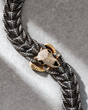 Close-up of Rams Head bracelet — detailed view of 18 ct gold ram-head skull, link texture and metal polish