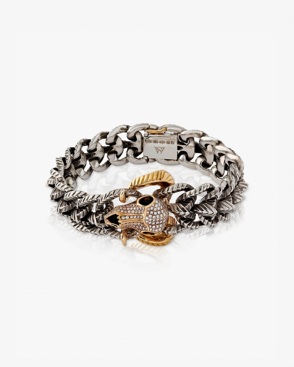 Stephen Webster Rams Head bracelet — 18 ct yellow gold skull-head centrepiece and polished silver/gold links, full view.