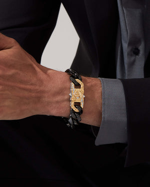 Model wearing Stephen Webster Blink King clasp in sterling silver & yellow gold with white diamonds and mother of pearl back plate