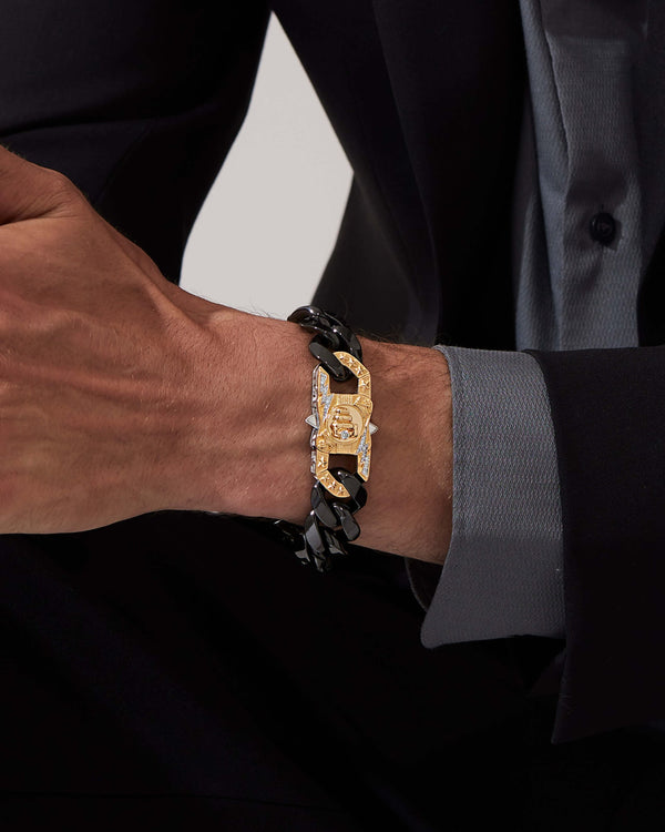Model wearing Stephen Webster Blink King clasp in sterling silver & yellow gold with white diamonds and mother of pearl back plate