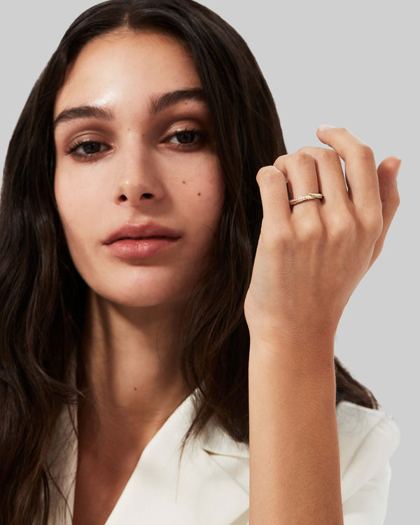 Stephen Webster Thorn Arc Solitaire Slimline Pavé Band worn on hand in 18K yellow gold with white diamonds