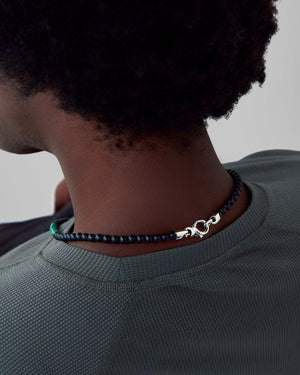 Reverse-side view of Stephen Webster Thorn Beaded Malachite Necklace showing continuous bead strand and sterling silver finish