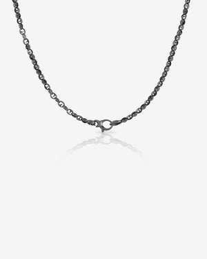 Hanging profile of Stephen Webster Thorn Classic 7 mm link black rhodium sterling silver chain showing thorn-inspired design