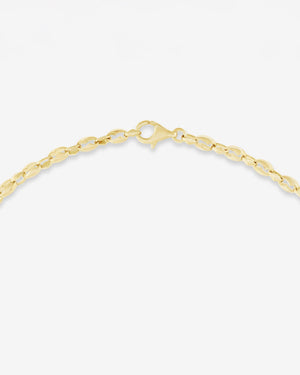 Detail of 18ct yellow gold craftsmanship on the Thorn Embrace Chain Link Choker