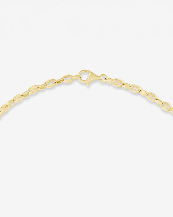 Detail of 18ct yellow gold craftsmanship on the Thorn Embrace Chain Link Choker
