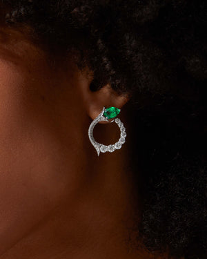 Thorn Embrace Inner Circle Emerald Earrings worn on ear, luxury fine jewellery styling