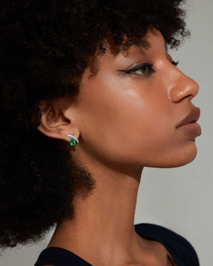 Thorn Embrace Pear Emerald Stud Earrings worn on ear, luxury fine jewellery styling