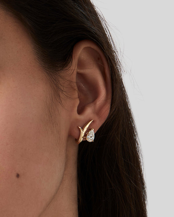 Thorn Embrace Pear Diamond Stud Earrings worn on ear, luxury fine jewellery styling