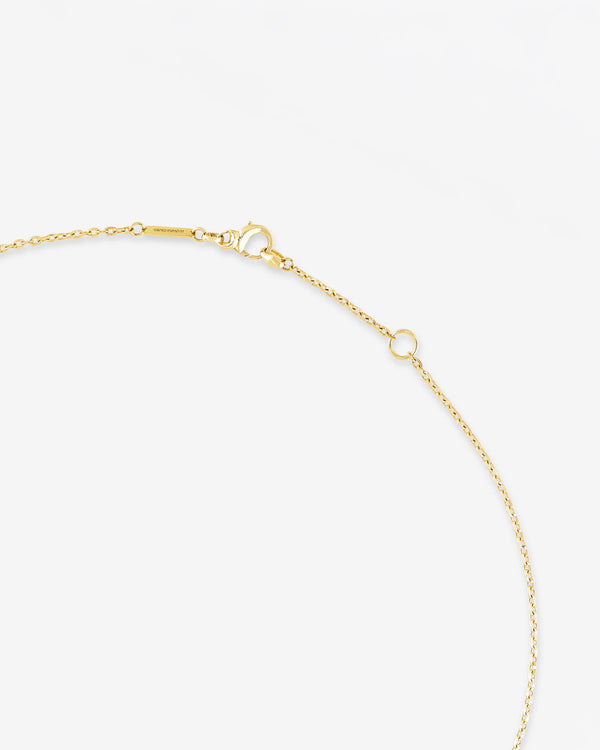 Detail of 18 ct yellow gold craftsmanship on the Thorn Embrace Tear Drop Necklace