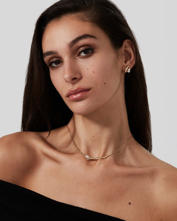 Thorn Embrace Tear Drop Necklace in 18 ct yellow gold worn on neck, luxury fine jewellery styling