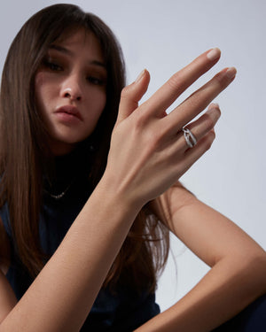 Thorn Embrace Bound Together Narrow Band Ring in 18ct white gold worn on hand, luxury jewellery style