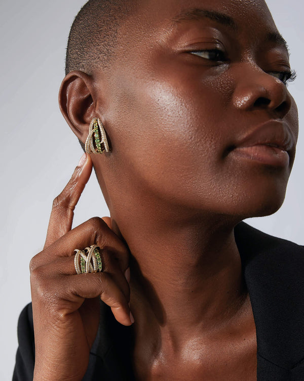 Thorn Embrace Bound Together Gem Band Ring in 18ct yellow gold with garnets styled with other luxury rings for a layered jewellery look