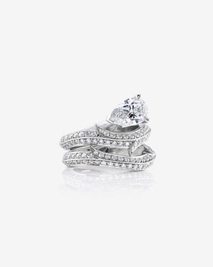 Platinum Thorn Floating Solitaire pavé diamond wedding band styled with matching engagement ring