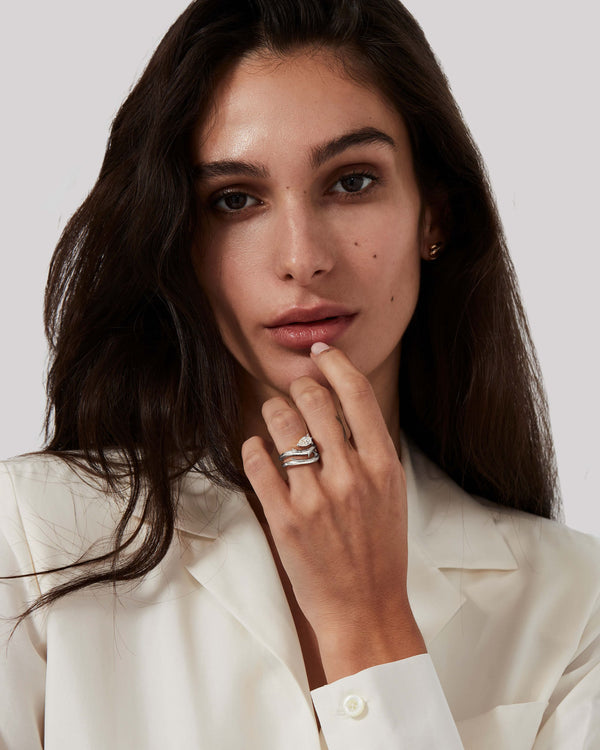 Stephen Webster Thorn Floating Solitaire Slimline Ring worn on hand in platinum with a white diamond