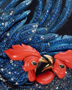 Close-up detail of black and white diamonds, blue sapphires and onyx eye on Titanium Cock Fight Brooch