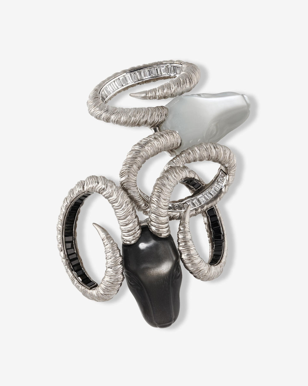 Titanium Ramification Brooch — grey titanium and 18 ct white-gold brooch set with white diamonds, black spinels and carved moonstone heads — front view