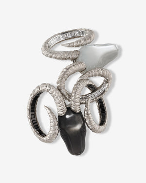 Titanium Ramification Brooch — grey titanium and 18 ct white-gold brooch set with white diamonds, black spinels and carved moonstone heads — front view