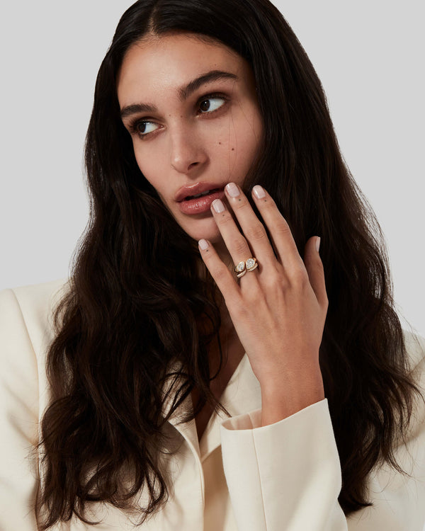 Yellow gold Toi et Moi pavé white diamond wedding band worn on hand