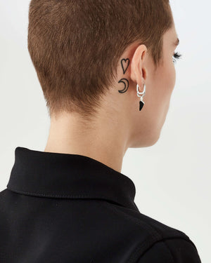 Reverse view of Stephen Webster Unithorn Onyx Charm showing polished sterling silver finish