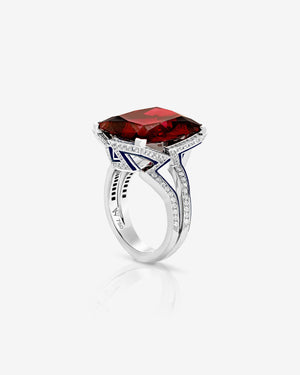 Vertigo Impossible red garnet cocktail ring in 18 ct white gold with dark blue enamel and diamonds — front view