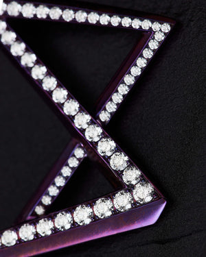 Close-up detail of white diamonds and pink titanium on Vertigo Light Pink Titanium Rubix Hoops