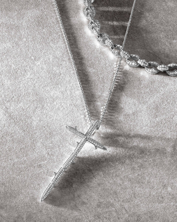 Close-up detail of white diamond pavé on Very Cross pendant in 18ct white gold