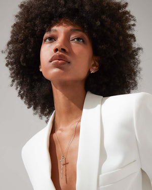 Very Cross white diamond pendant in 18ct white gold worn on model, luxury styling