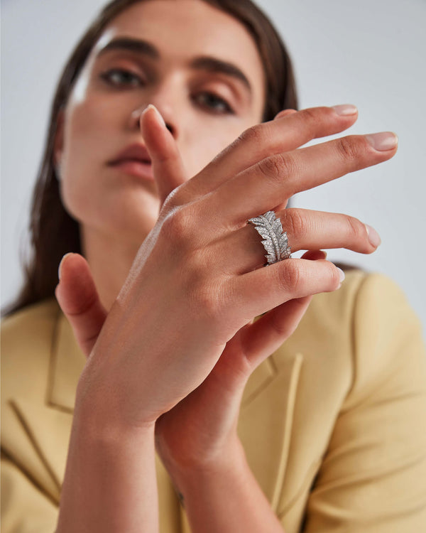Eternal Plume Band Ring worn on finger showing 18ct white gold and white diamond detail