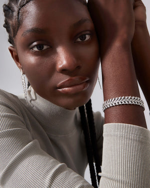 White Diamond Pavé Open Plume Slimline Linked Bracelet worn on wrist showcasing sparkle and design