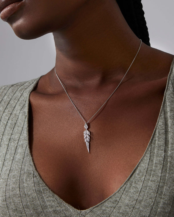 White Diamond Pavé Tail Feather Drop Pendant worn on neck showcasing feather-inspired fine jewellery design