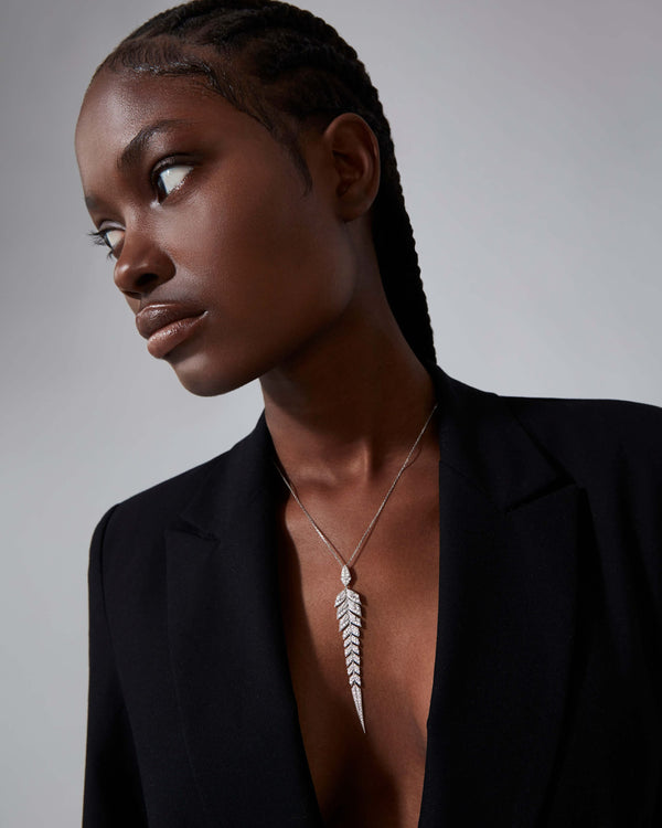 White Diamond Pavé Tail Feather Long Drop Pendant worn on neck showcasing feather-inspired fine jewellery design